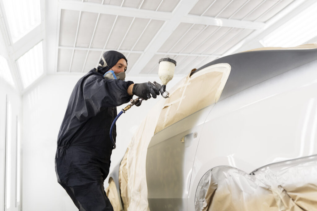 service worker painting car auto service scaled